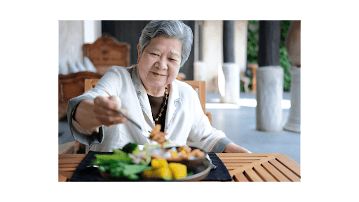 Healthy Eating Habits For Seniors - elderly woman eating a healthy meal