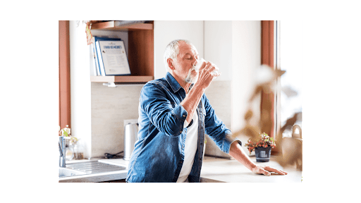 Healthy Eating Habits For Seniors - man drinking a glass of water