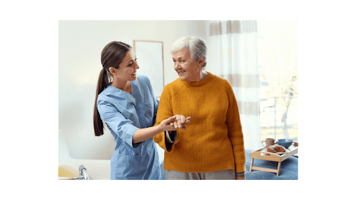 Healthy Eating Tips For Seniors - caregiver lending a helping hand to an elderly woman