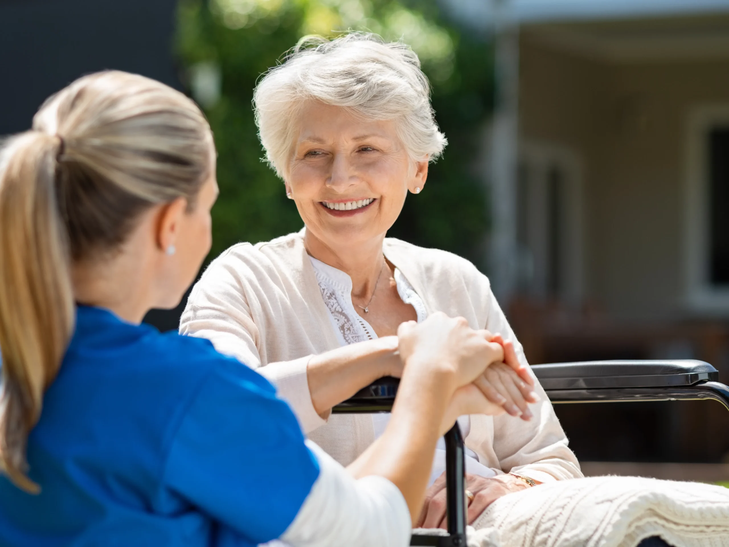 professional in-home care from woman nurse to smiling elderly woman