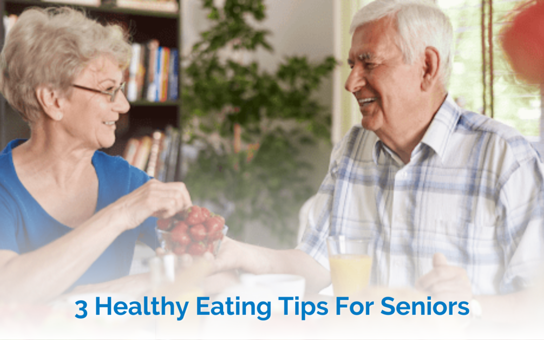 healthy eating habirs for seniors - elderly man and woman sharing a bowl of strawberries and drinking orange juice