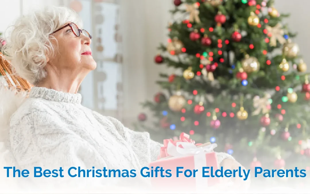 best christmas gifts for elderly parents - elderly lady sitting on a bench in front of a christmas tree holding a red present